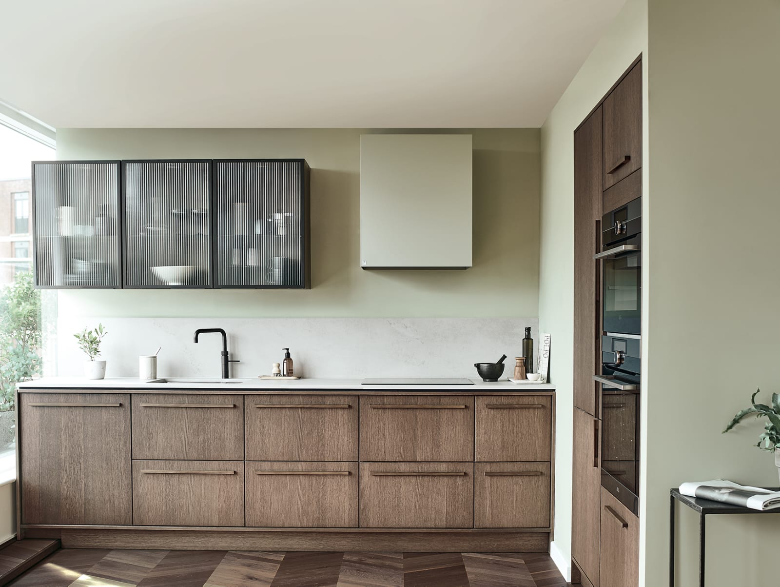Nordic Nature. Modern wooden kitchen design with a Nordic influence. Featured floating worktops, a ribbed plinth and rounded end panels.